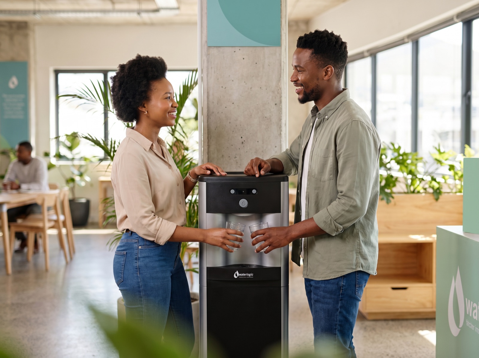 Colleagues chatting at a Vending Solutions water cooler