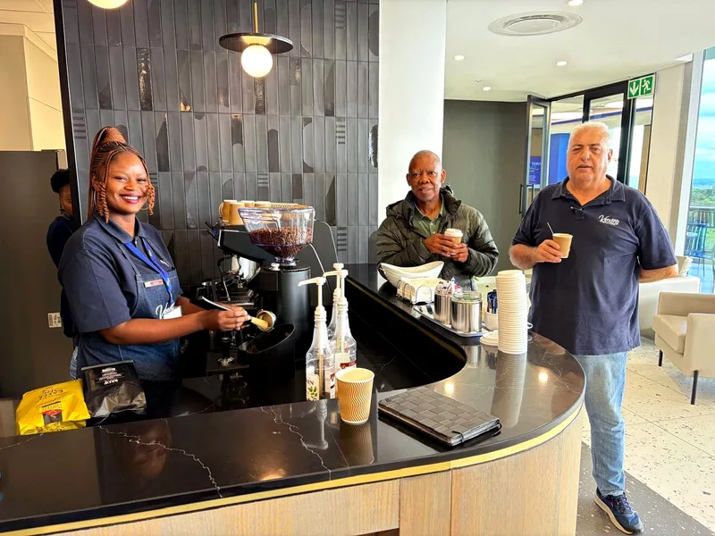 Our barista serving at a client coffee bar