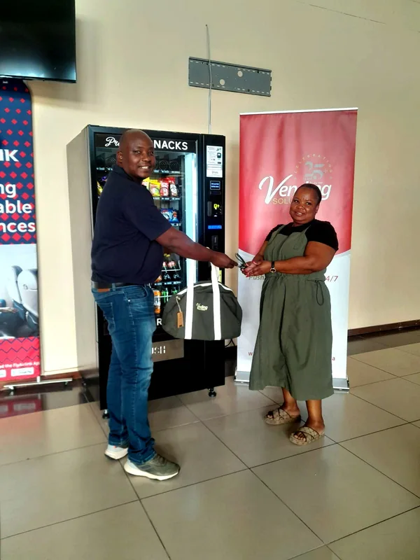 Snack machine handover at the airport