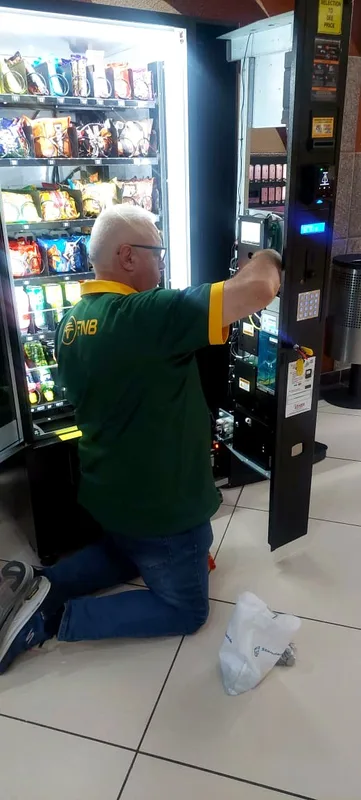 Restocking on the mall concourse
