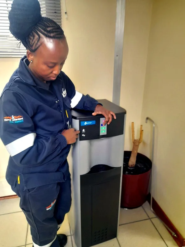Technician checking an office water cooler