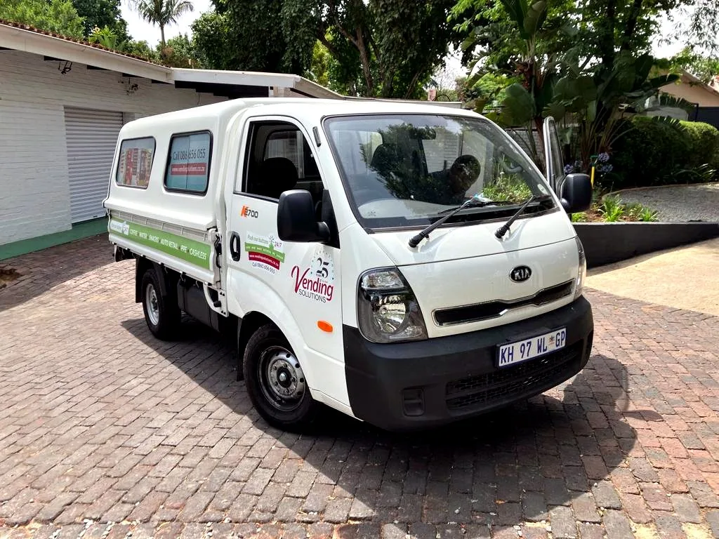 Branded Vending Solutions delivery bakkie parked at a client site
