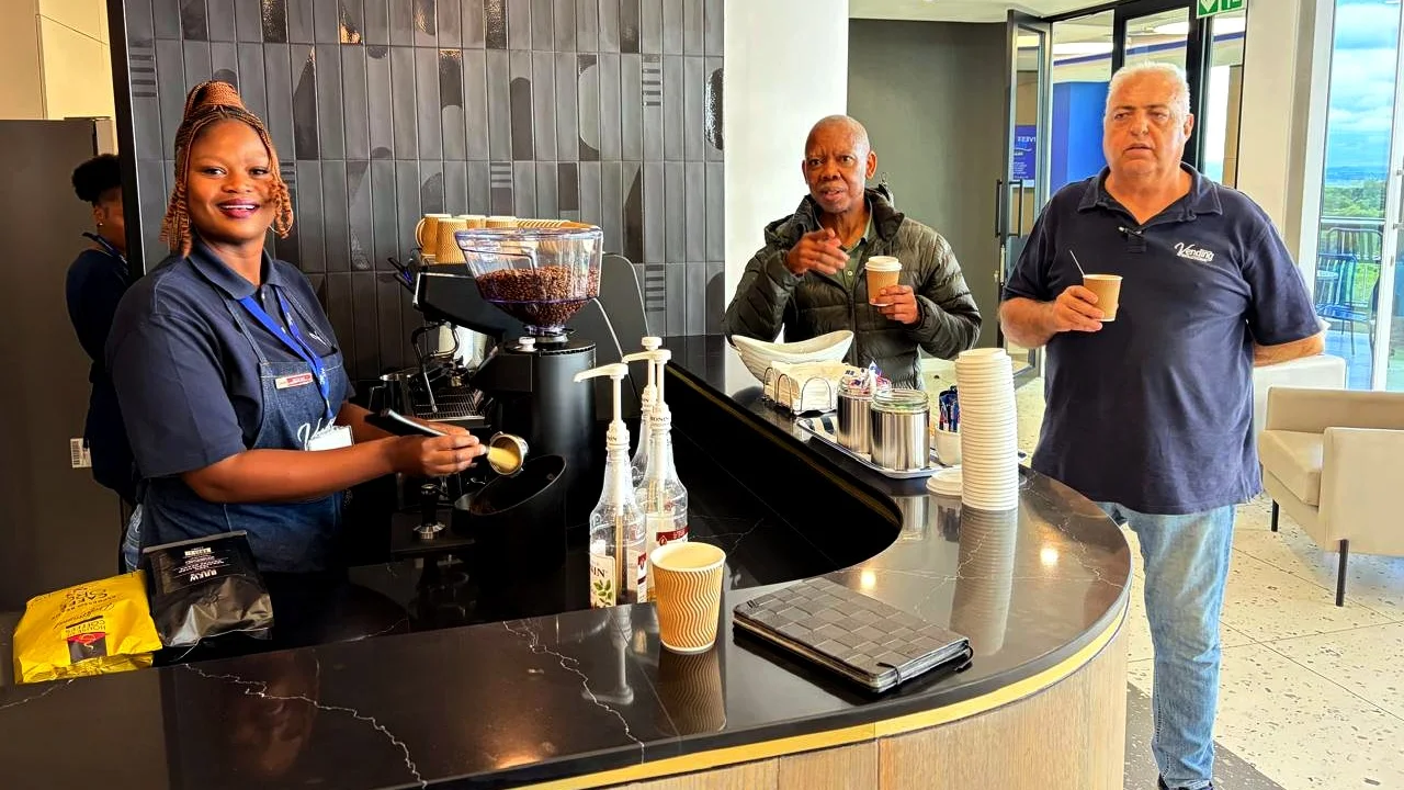 Staff enjoying barista coffee at an office coffee bar installed by Vending Solutions