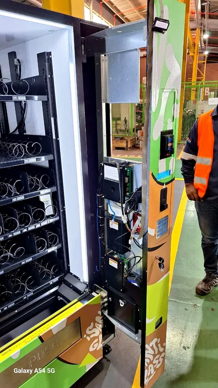 An open PPE dispenser being set up in a plant