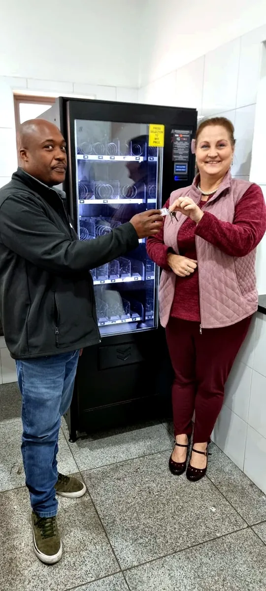 Keys handed over at a canteen PPE dispenser