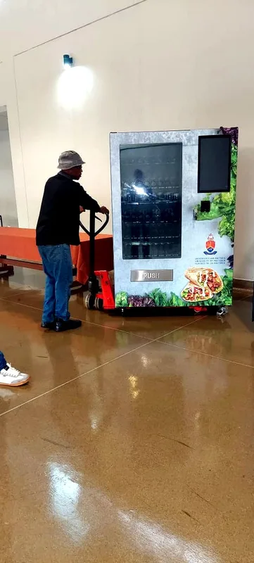 Walking a fresh food machine into position