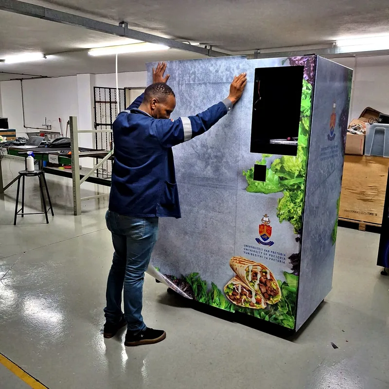 Moving a university branded machine into its hall