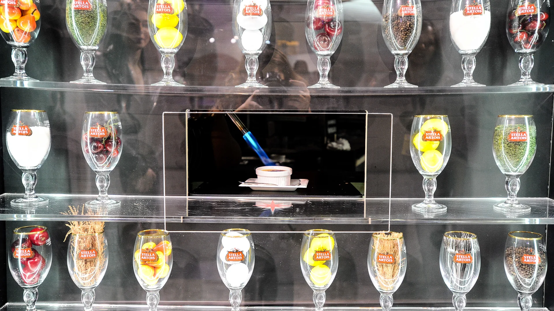 Stella Artois artisan vending dispenser presenting rows of branded chalices behind glass